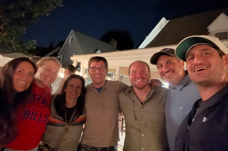 Friends together outside on a warm evening during the weekend